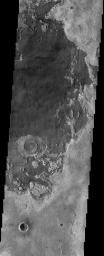 The remarkable terrain at the 'center' of Mars (0 degrees latitude and longitude), as seen in this NASA Mars Odyssey image, is called Meridiani Planum. It hosts a rare occurrence of gray crystalline hematite.