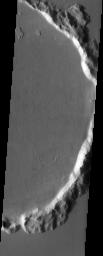 The predominant feature in this image from NASA's Mars Odyssey spacecraft is a large flooded crater. Are the flows lava or mud? Scientists don't agree.