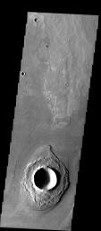 This image from NASA's Mars Odyssey shows fine-scale textures around a crater southwest of Athabasca Vallis. These fine scale ridges are most likely the remnants of older flood eroded layered rocks and not longitudinal grooves carved out of the landscape.