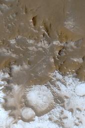 NASA's Mars Global Surveyor shows Charitum Montes, south of Argyre Planitia on Mars, in early June 2003. Bright features are surfaces covered by frost.