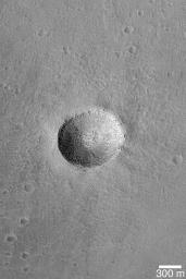 NASA's Mars Global Surveyor shows a crater on the floor of the caldera, a large volcanic/collapse crater, of a giant martian volcano, Arsia Mons on Mars.