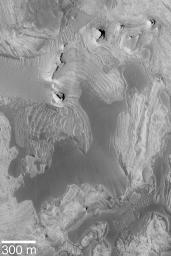 NASA's Mars Global Surveyor shows Tithonium Chasma is one of the troughs of the vast Valles Marineris canyon system on Mars as seen by NASA's Mars Global Surveyor.