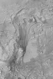 NASA's Mars Global Surveyor shows an outcropping of ancient, sedimentary rock in a crater in western Arabia Terra on Mars.