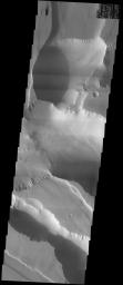 NASA's Mars Odyssey spacecraft captured this image in September 2003, showing the westernmost end of the enormous Valles Marineris canyon system on Mars wherein lies the ruptured landscape known as Noctis Labyrinthus.