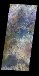 An enhanced color image from the eastern edge of Acidalia Planitia shows a heavily eroded landscape just south of the outflow channel called Mawrth Vallis. This image was captured by NASA's Mars Odyssey spacecraft in October 2003.