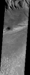 The slopes and floor of Eos Chasma, a portion of the vast Valles Marineris canyon complex, are located near an early landing site for the MER rovers. This image was captured by NASA's Mars Odyssey spacecraft in October 2003.