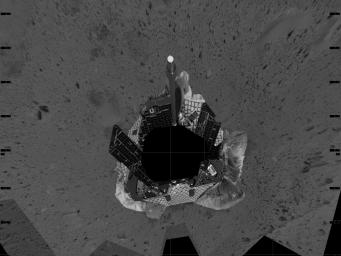 This mosaic image taken by the navigation camera on NASA's Mars Exploration Rover Spirit represents an overhead view of the rover as it prepares to roll off the lander and onto the martian surface.