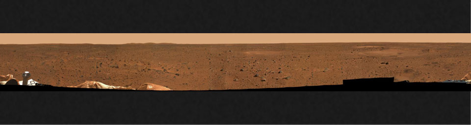 This is a medium-resolution version of the first 360-degree panoramic view of the martian surface, taken on Mars by NASA's Mars Exploration Rover Spirit's panoramic camera. Part of the spacecraft can be seen in the lower corner regions.