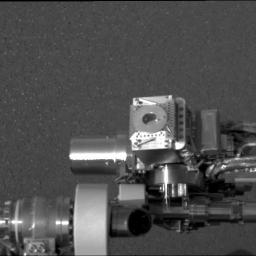 NASA's Mars Exploration Rover Opportunity shows the rover's Moessbauer spectrometer (circular device in center), located on its instrument deployment device, or 'arm.'