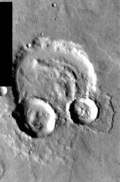 This image, part of an images as art series from NASA's 2001 Mars Odyssey released on Feb 18, 2004 shows a cratered martian suface strongly resembling a pair of headphones.