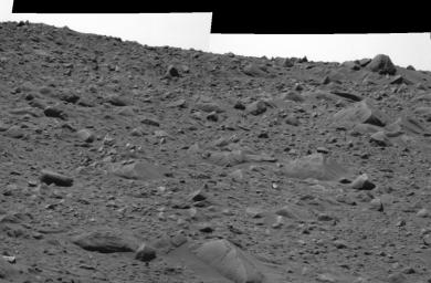 This image taken by NASA's Mars Exploration Rover Spirit shows the rocky road the rover traversed away from the rim of the crater called 'Bonneville.' To the upper right is the rock dubbed 'Hole Point.'