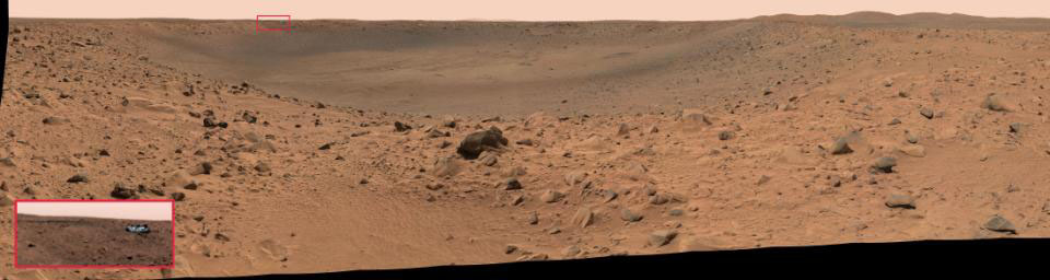 NASA's Mars Exploration Rover Spirit acquired this panoramic camera image on the March 12, 2004. The reflective speck about 200 meters (650 feet) away, on the far crater rim, was identified as Spirit's protective heatshield.