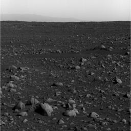 NASA's Mars Exploration Rover Spirit took this panoramic camera image April 5, 2004. Spirit is looking to the southeast, and through the martian haze has captured the rim of Gusev Crater approximately 80 kilometers (49.7 miles) away on the horizon.