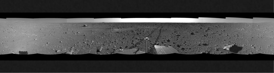 This left-eye view was created from navigation camera images that NASA's Mars Exploration Rover Spirit acquired on May 12, 2004. The tracks show the path the rover had traveled so far on its way to the base of the 'Columbia Hills.'