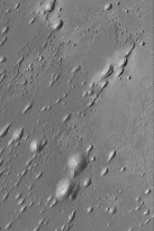 NASA's Mars Global Surveyor shows yardangs located in western Arabia Terra, northwest of the Sinus Meridiani region where the Mars Exploration Rover, Opportunity, has examined ancient sedimentary rocks. 