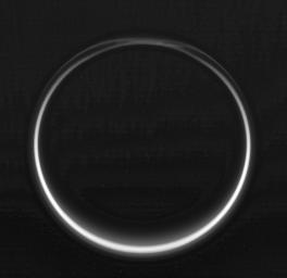 This image of Titan's night side was taken during NASA's Cassini spacecraft very close flyby of the smoggy moon on Feb. 15, 2005.