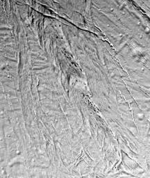 This high-resolution image from NASA's Cassini spacecraft shows a region of 'smooth plains' terrain on the surface of Saturn's moon Enceladus, located slightly north of the equator on the moon's Saturn-facing hemisphere.