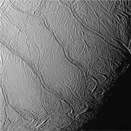 This view of Saturn's moon Enceladus captured by NASA's Cassini spacecraft, looks toward the moon's terminator and shows a distinctive pattern of continuous, ridged, slightly curved and roughly parallel faults within the moon's southern polar latitudes.
