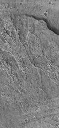 NASA's Mars Global Surveyor shows lava flows on the middle west flank of the large martian volcano, Ascraeus Mons on Mras.