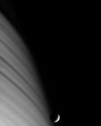 NASA's Cassini spacecraft's ability to remain precisely and steadily pointed at targets, such as Saturn's moon Mimas, yields sharp images despite the relatively high speed at which the spacecraft moves.