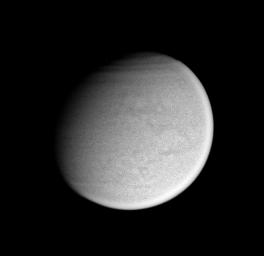 Surface details on Titan are just visible in this image captured by NASA's Cassini spacecraft taken on Feb. 26, 2005. Bands in the atmosphere over Titan's extreme northern latitudes.
