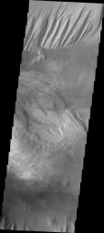 This image released on Oct 5, 2004 from NASA's 2001 Mars Odyssey shows an area on Mars in Candor Chasma. The imaged area is close to the depression that connects Candor and Melas Chasmas together.