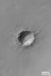NASA's Mars Global Surveyor shows a small meteor impact crater with bouldery ejecta in the Arabia Terra region of Mars.