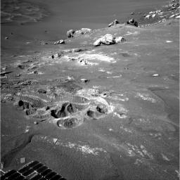 Wheel tracks from NASA's Mars Exploration Rover Opportunity show where the rover struggled for traction while driving away from 'Wopmay' rock inside 'Endurance Crater' on Oct. 29, 2004.