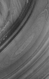 NASA's Mars Global Surveyor shows a depression eroded into Mars' north polar layered materials.