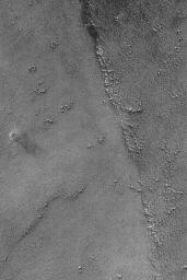 NASA's Mars Global Surveyor shows a dust devil in far western Syria Planum on Mars.