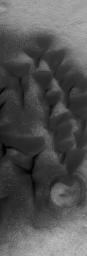 NASA's Mars Global Surveyor shows low albedo sand dunes on the floor of a crater in southern Noachis Terra on Mars.