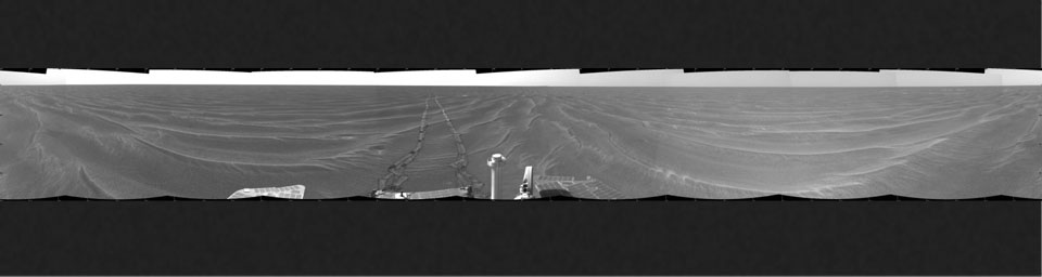 NASA's Mars Exploration Rover Opportunity took this cylindrical projection 360-degree view of the rover's surroundings on March 6, 2005. Opportunity had completed a drive across the rippled flatland of the Meridiani Planum region.
