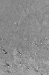 NASA's Mars Global Surveyor shows exhumation of flow surfaces from beneath a material that was eroded by wind in the Cerberus/Zephyria region of Mars.