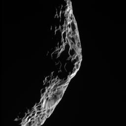 As NASA's Cassini spacecraft sped away from its close encounter with Saturn's moon Hyperion on Sept. 26, 2005, it took this parting shot of the battered moon's shadowy limb.