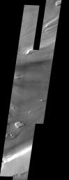 This image from NASA's Mars Odyssey spacecraft shows the Kasei Vallis complex on Mars which contains two main channels that run east-west across Tempe Terra and empty into Chryse Planitia.