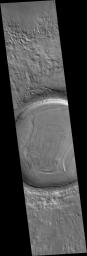 NASA's Mars Global Surveyor shows details on the floor and in the ejecta blanket of a northern middle-latitude martian crater.