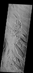 The patches of chaotic material in this image have formed on the floor of Mangala Valles on Mars as seen by NASA's 2001 Mars Odyssey.