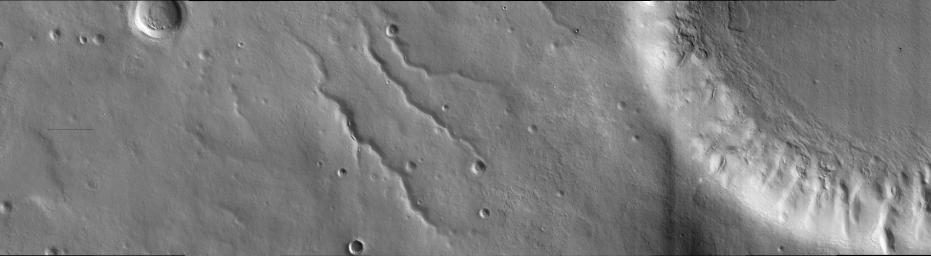 This image taken by NASA's Mars Reconnaissance Orbiter on March 24, 2006, in the mid-latitudes of Mars' southern hemisphere near the giant Argyre impact basin. It is located just to the west of a prominent scarp known as Bosporos Rupes.