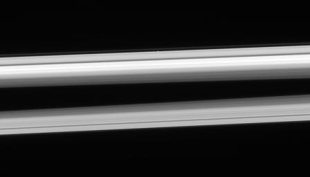 NASA's Cassini spacecraft looks up from beneath the ringplane to spy Atlas hugging the outer edge of the A ring, above center. This image was taken in visible light with the Cassini spacecraft narrow-angle camera on Feb. 23, 2006.