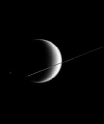 This poetic scene shows the giant, smog-enshrouded moonTitan behind Saturn's nearly edge-on rings. Much smaller Epimetheus is just visible to the left of Titan in this image from NASA's Cassini spacecraft.