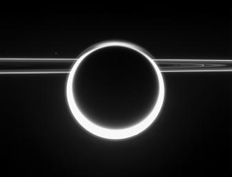 Dazzling Titan glows with a 360-degree sunset as light scatters through its very extended atmosphere. The rings show their unlit side to NASA's Cassini, as the spacecraft viewed them from slightly above the ringplane.