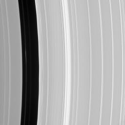 In this image from NASA's Cassini spacecraft there is a bright clump-like feature visible within the Encke Division. Also discernible are periodic brightness variations along the outer (right side) gap edge.