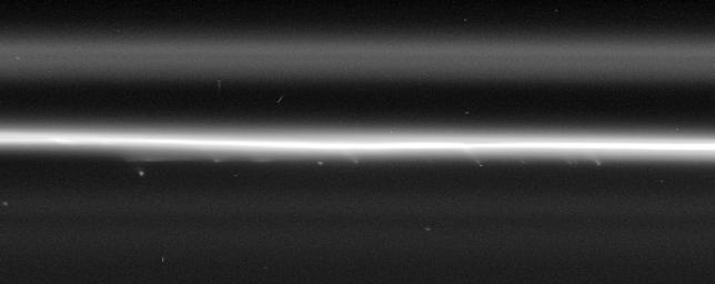 Multiple faint, streamer-like objects can be seen in this high resolution Cassini spacecraft view of the F ring's bright core. This image was taken in visible light with NASA's Cassini spacecraft's narrow-angle camera.