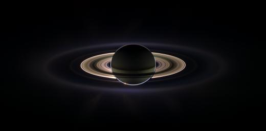 With giant Saturn hanging in the blackness and sheltering NASA's Cassini from the sun's blinding glare, the spacecraft viewed the rings as never before, revealing previously unknown faint rings and even glimpsing its home world.