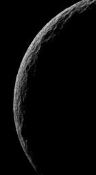 The cold, cratered landscape of Saturn's moon Tethys shines in stark relief in this crescent view. This view was obtained by NASA's Cassini spacecraft on June 29, 2007, from a distance of approximately 38,000 kilometers (24,000 miles).