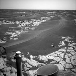 NASA's Mars Exploration Rover Opportunity continues to cut southward across a plain marked by large sand ripples and a pavement of outcrop rock. This image was taken on Opportunity's sol 795, April 19, 2006.