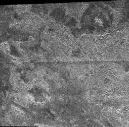 This image from the Synthetic Aperture Radar instrument on NASA's Cassini spacecraft shows the radar-bright region Xanadu and two circular features interpreted to be degraded impact craters.