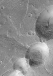 This NASA Mars Global Surveyor image shows partially-filled collapse pits on the eastern flank of Alba Patera, a large volcano in northern Tharsis.