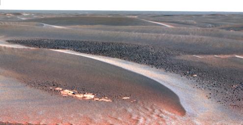 This view was taken by NASA's Mars Exploration Rover Opportunity on April 27, 2006, as it continued to traverse from Erebus Crater toward Victoria Crater, the rover navigated along exposures of bedrock between large, wind-blown ripples.