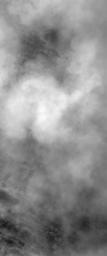 NASA's Mars Global Surveyor shows billowing clouds of dust rising from a storm southeast of Hellas Planitia on Mars. The dust storm in this case obscured the Mars Orbiter Camera's view of the martian surface.